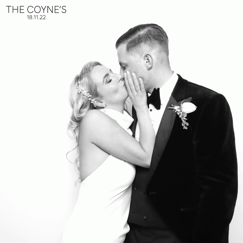 Bride and Groom pose for the black and white photo booth hire at Hedsor House