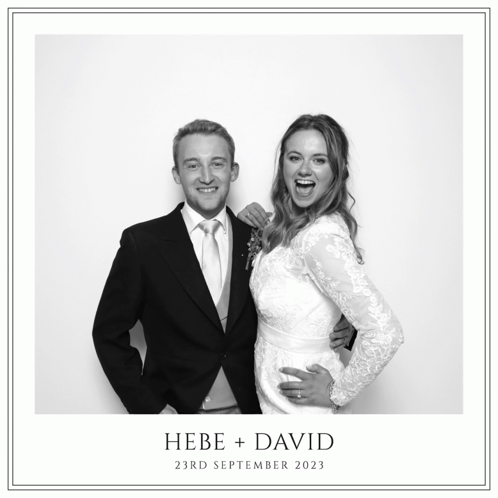 Bride & Groom pose for the black and white photo booth at their Hurlingham Club Wedding in London
